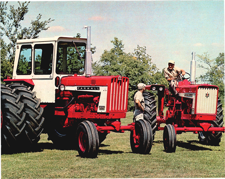 Two 1954 Farmalls with two men talking